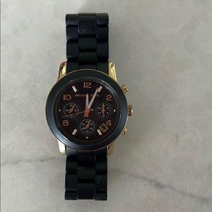 Michael Kors black and gold watch.